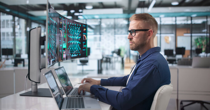 Data Scientist Analyzes Neural Networks Carefully Using Laptop