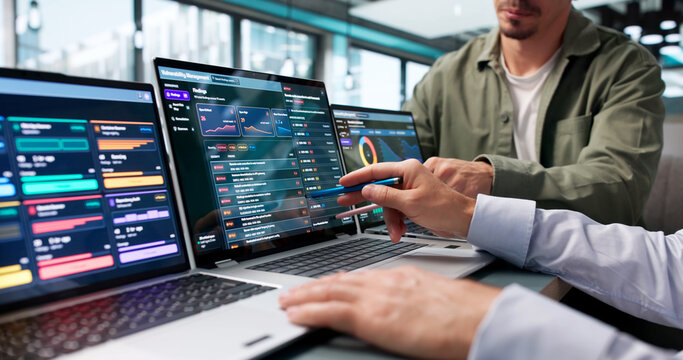 Cybersecurity Analyst Reviews Risk Findings On Laptop