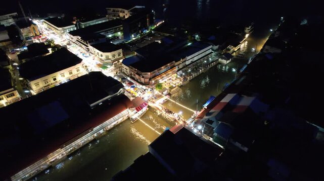 Aerial night view of Amphawa Floating Market scenery, Thailand