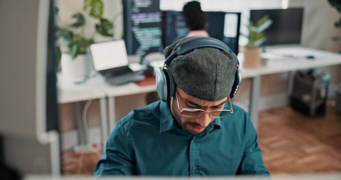 Coding, headphones or man in office with computer, radio streaming or debug error in web review. Serious, digital or software engineer with tech, code correction or programming assessment with music.
