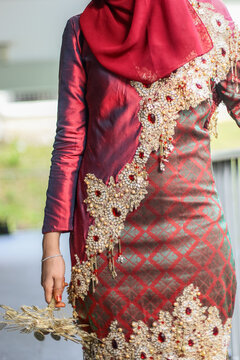 Embellished Maroon Baju Kurung Songket Attire