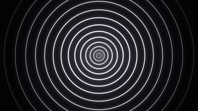 A hypnotizing minimal motion graphic featuring endless white concentric circles radiating outward against a dark background in a seamless loop. This clean geometric animation evokes a sense of modern 