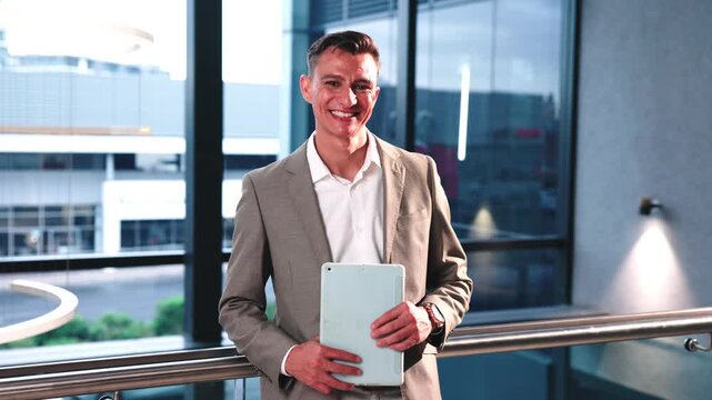 Face, man and happy with tablet in office for corporate banking, risk management and job integrity. Confident, compliance officer and tech at firm for regulatory expertise, liaison or audit readiness