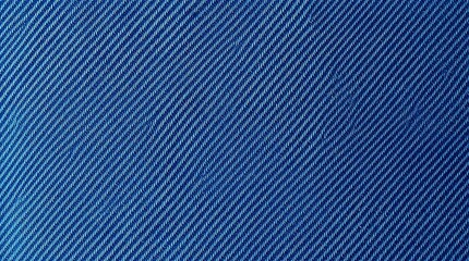 Fototapeta premium ndigo blue denim fabric, clear diagonal twill weave, faded creases, fine white warp threads showing through