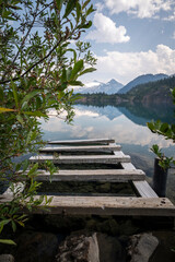 Fototapeta premium Beautiful view to old wooden dock in Garibaldi Lake, Squamish