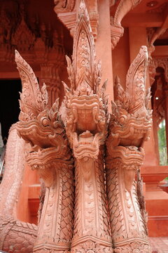 Ornate terracotta three headed Naga serpent statue