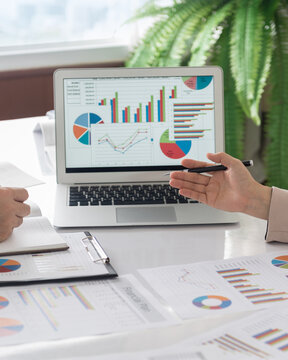 accountant team review accounts report and using digital accounting program software on computer for working accounting standards system at office. vertical view.