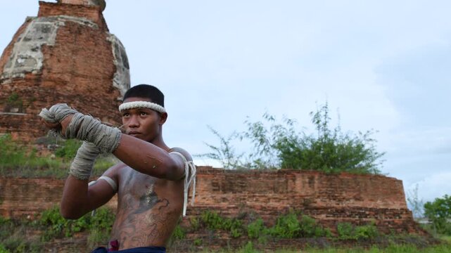 Muay Boran Fighter Performing Martial Arts Stance Outdoors