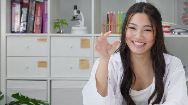 Smiling Student Throwing Paper Airplane in Science Laboratory