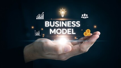 Obraz premium Business model concept with professional holding a glowing digital strategy interface