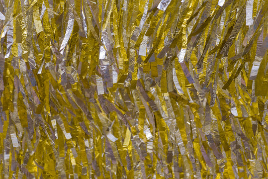 Gold and Silver Metallic Foil Fringe Texture Background with Shimmering Tinsel Curtain