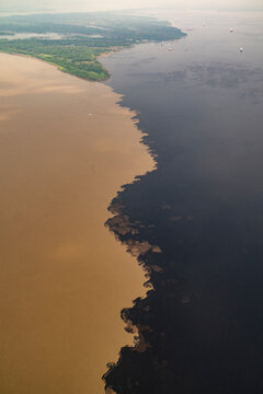 Beautiful aerial view from plane to meeting of the waters in Manaus