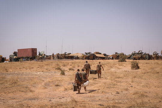 French army desert camp spreading out under a white sky during a counter-terrorism deployment in the Sahel near Tin-Akoff, Burkina Faso