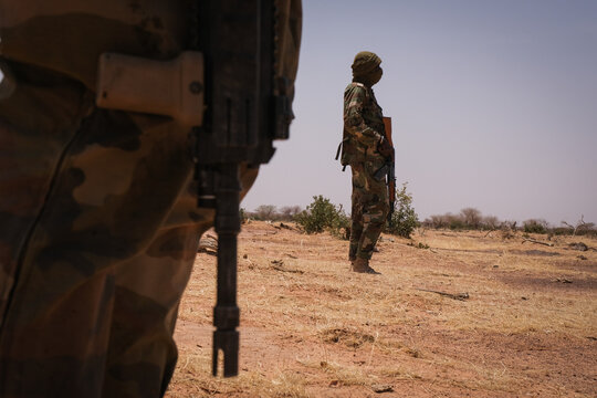 French army sentry watching the plain during a desert operation in the Sahel near Tin-Akoff, Burkina Faso