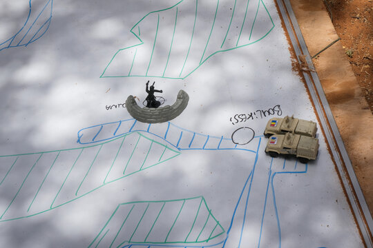 Arrows and hatching drawn straight on a military map during a French army operation in the Sahel near Tin-Akoff, Burkina Faso