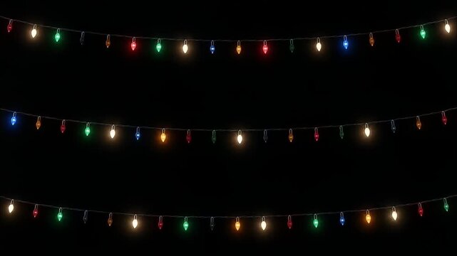 Rows of Twinkling Multicolor Holiday String Lights on Black Background
