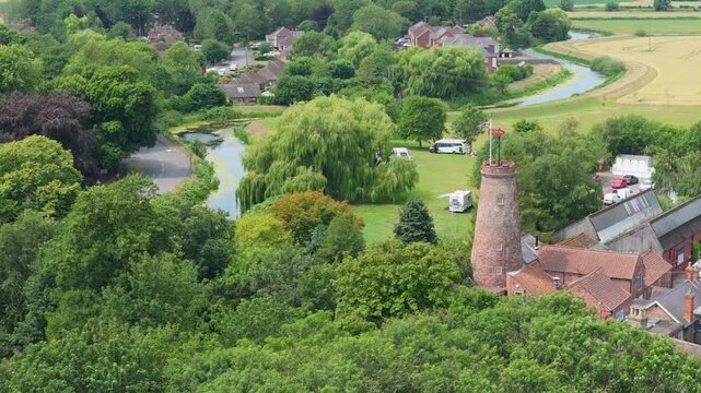 Lush greenery surrounds a tranquil village