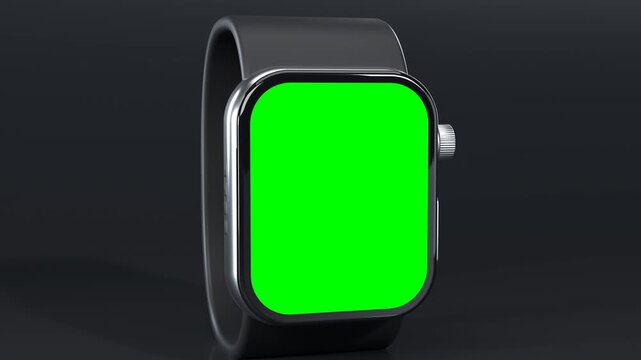 Smartwatch with black band and green screen, cinematic camera push in with rack focus in dark studio