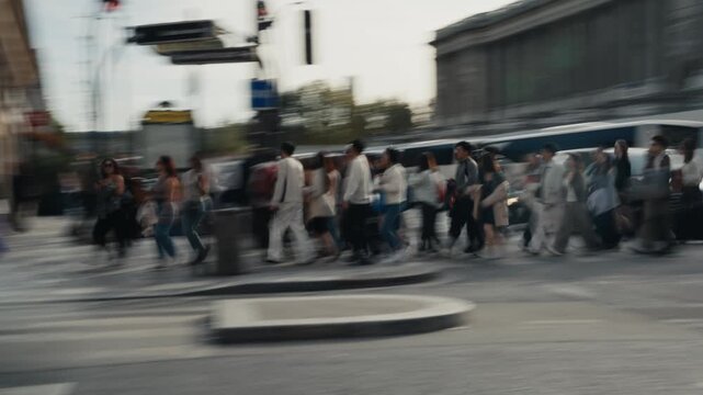 People crossing a busy paris street in motion blur