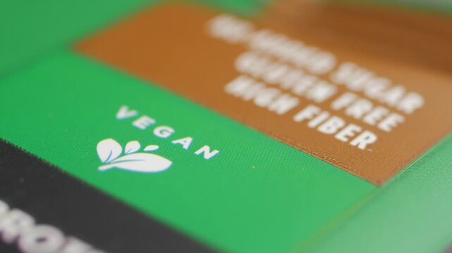Healthy food packaging label with vegan gluten free and high fiber text in macro detail shot.