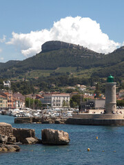 Fototapeta premium Harbor Lighthouse and Mountain Landscape in Cassis France