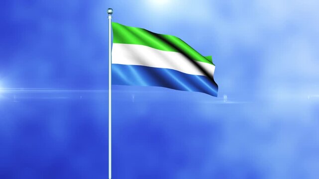 Sierra Leone national flag waving in the wind against a blue sky background loop animation