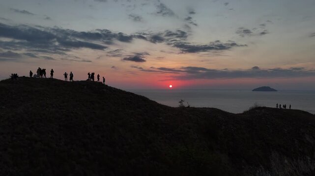 Panoramic sunset landscape from Sylvia Hill (Bukit Silvia) in Labuan Bajo during the warm golden hour.