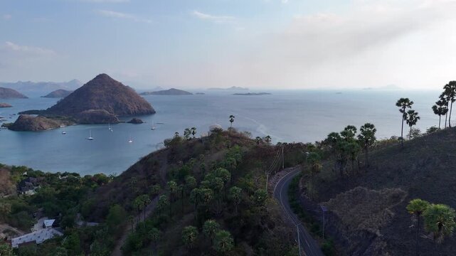 Sunset view from Bukit Silvia overlooking the stunning landscape and islands of Labuan Bajo, Flores, Indonesia