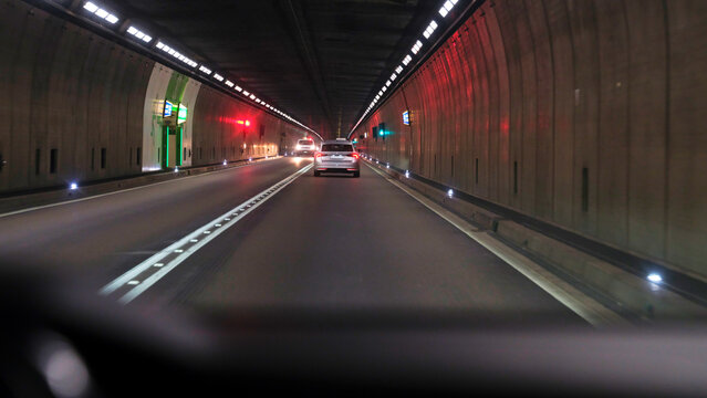 Gotthard Tunnel drive with lit roads