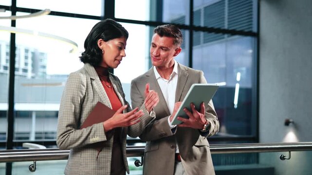 Business, review or team in firm with tablet, forecast discussion or growth plan in finance feedback. People, digital or wealth advisor with tech, budget outlook or collaboration on strategy report.