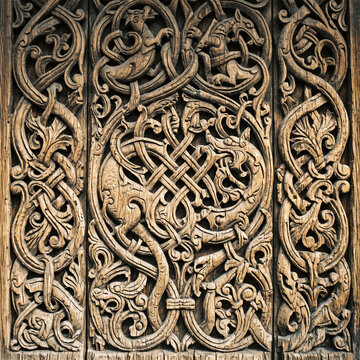 norse wood carving ornament with traditional viking animal patterns