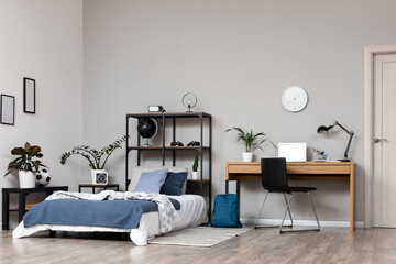 Remote learning and student lifestyle, modern bedroom interior with study desk and laptop for homeschooling or online education in a cozy home environment © Pixel-Shot