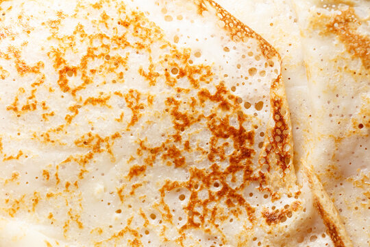 A stack of pancakes with a browned surface