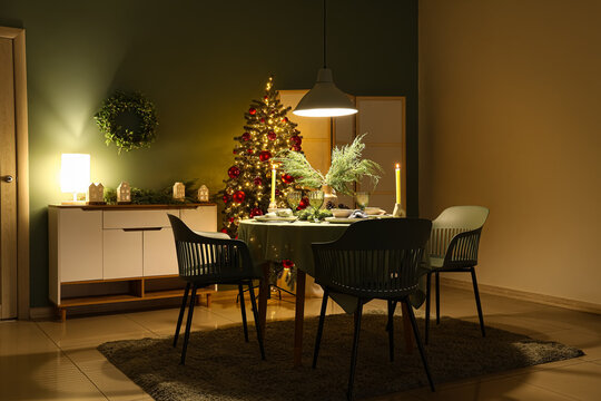 Christmas dinner celebration, festive dining room interior with decorated tree and table setting for holiday gathering in a cozy home atmosphere