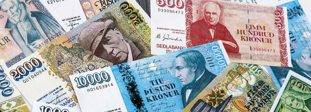 Icelandic krona money banknotes pile on table. Iceland bills of ISK currency. Concept of economy