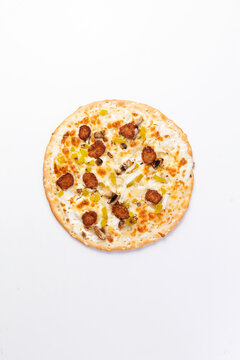 Thin crust pizza with sausage and peppers food preparation
