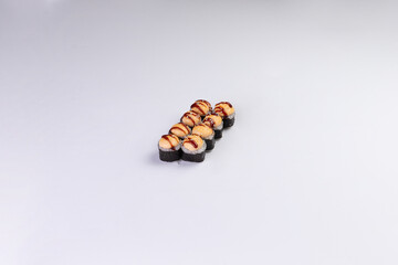 Baked sushi rolls with creamy topping and teriyaki sauce food © Игорь Соколов
