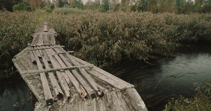 Old Weathered Wooden Footbridge Over Narrow Country Stream