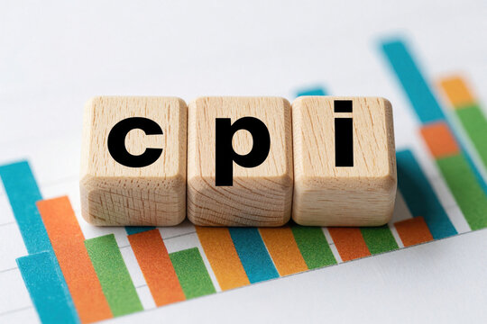 Wooden blocks with CPI text on financial bar chart. Consumer Price Index concept shows inflation rate, economic data. Business graph background represents market trends, cost of living, money