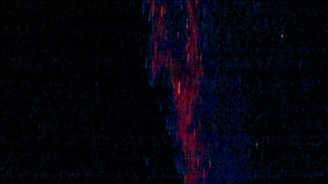 Stream of particles moves slowly downward with sparkling scintillations.