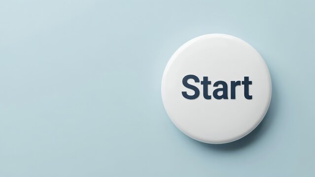 A white round start button with bold dark text is centered on a clean light blue surface. Perfect for web design concepts and business launch initiatives.