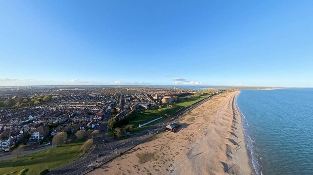 Travel and History: Aerial Drone Shot of Sunny Southsea Seafront and Promenade Overlooking the Solent in Portsmouth, Hampshire
