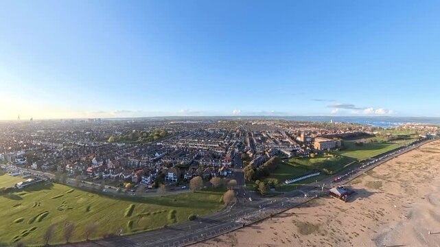 Travel and History: Aerial Drone Shot of Sunny Southsea Seafront and Promenade Overlooking the Solent in Portsmouth, Hampshire