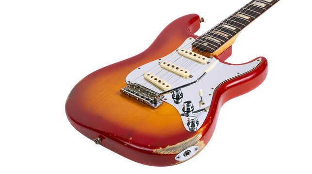 Isolated aged electric guitar in classic sunburst finish, vintage musical instrument close-up view.