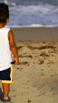 Boy looking in awe at the magnitud of the ocean