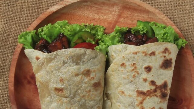 tortilla wrap with chicken and vegetables. Top view. 