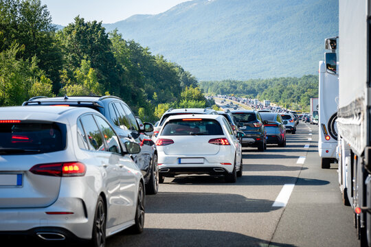 Heavy traffic jam with queue of cars on highway during summer holiday travel season