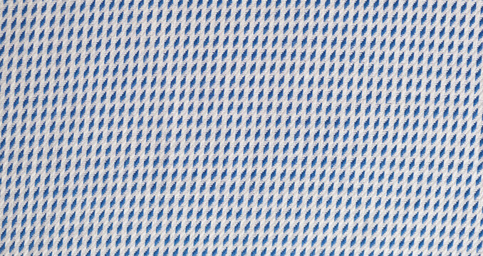 Close up of blue and white cotton textile texture with rhombus pattern