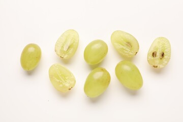 Fototapeta premium Fresh ripe grapes on white background, flat lay