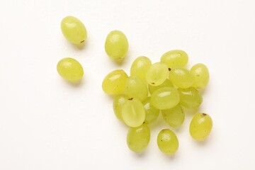 Fototapeta premium Fresh ripe grapes on white background, flat lay
